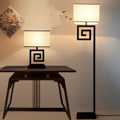 Retro style table lamp with fabric shade and iron base, remote control operation