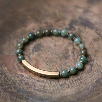 Layered retro ethnic bracelet for men and women with stone beads and brass spacers.