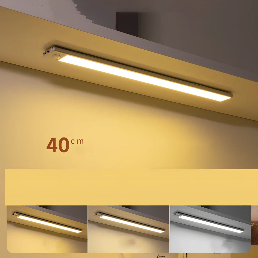 Silver LED inductive light strip, 40cm length, attached to shoe cabinet shelf with 3M adhesive
