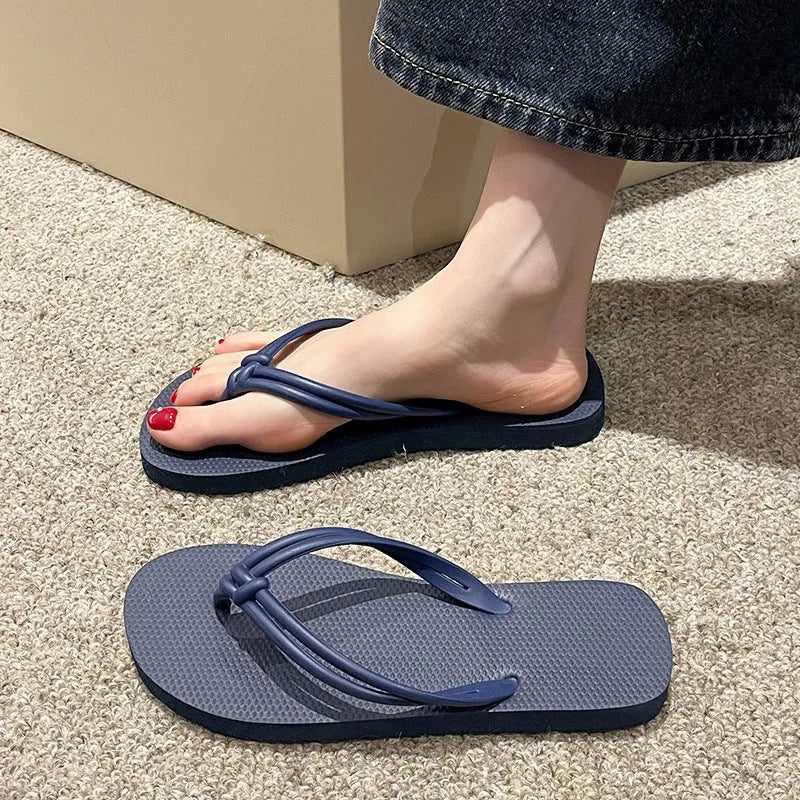 PVC injection moulded flip flops in toe-covering casual style with non-slip sole