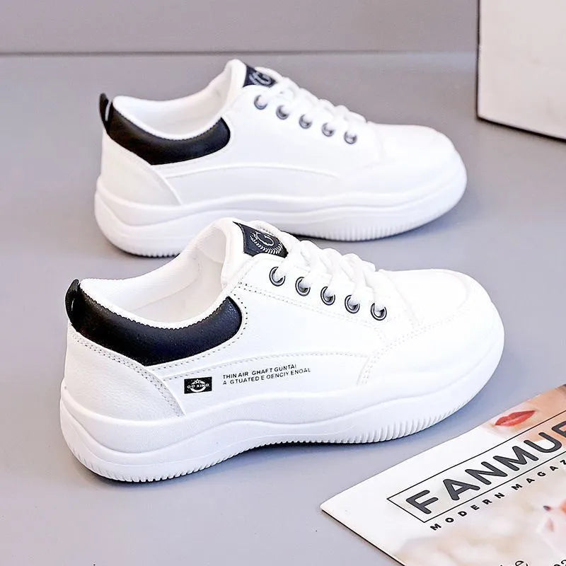 Women's white Korean-style lace-up pumps with a cross strap detail and a mid heel.