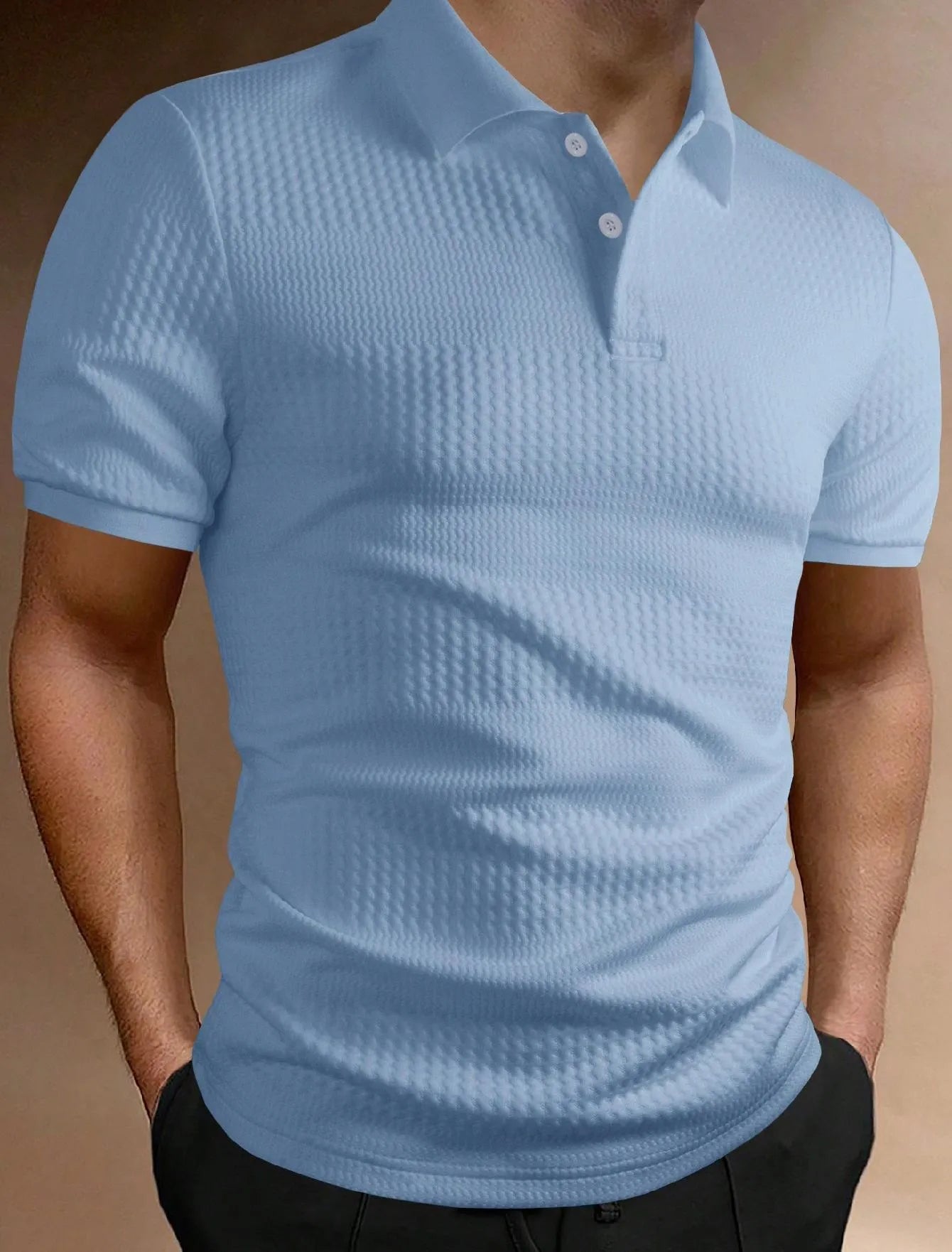 Man wearing a striped loose-fit polo shirt in light blue, showing short sleeves and asymmetric detail.