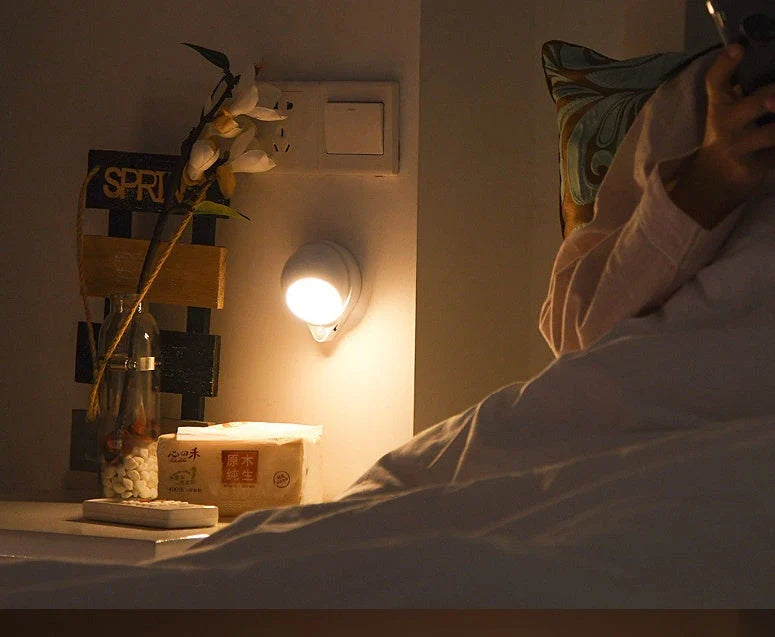 A versatile LED motion sensor night light with a 360-degree rotating head, perfect for illuminating any space in your home or office.