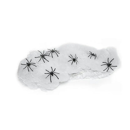 White cotton spider web Halloween decoration with multiple spiders draped over furniture for spooky atmospheric display