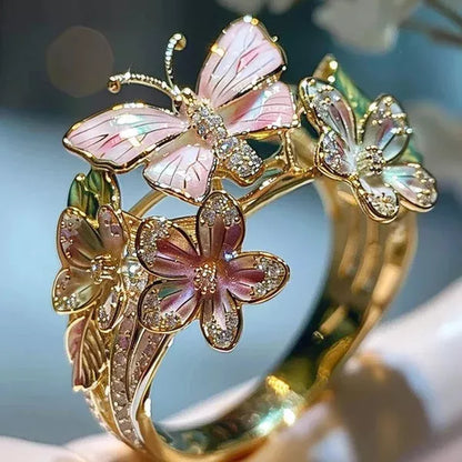 Adjustable crystal butterfly flower ring in gold, silver, and rose gold finishes