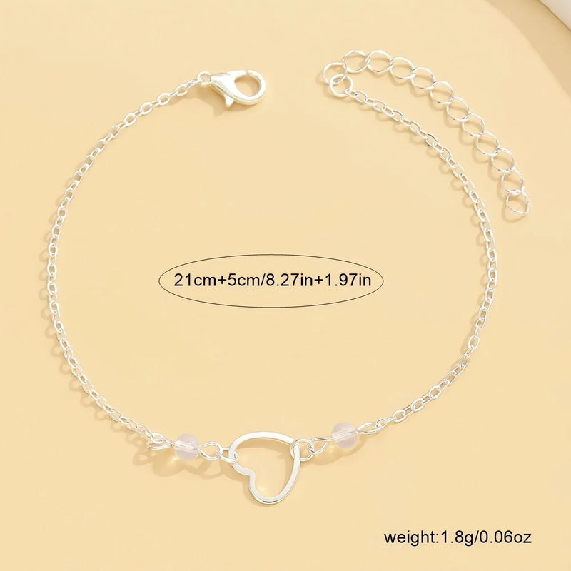Women's anklet jewellery with heart-shaped pendant in alloy metal featuring an adjustable chain for customised fit, available in gold or silver colour options with a simple geometric style design suitable for casual wear.