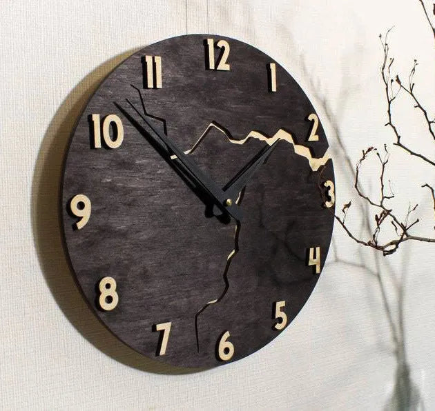 Modern wooden wall clock with crack finish surface in circular design showing time markers