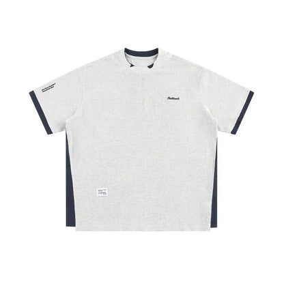 Navy blue loose waffle knit T-shirt with retro white alphabet embroidery on the chest.