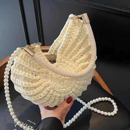 Handmade woven cloth bag with double shoulder straps in shell shape showing open pocket design