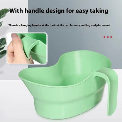 Green plastic gargle cup for bedridden elderly oral care showing modern simplicity design
