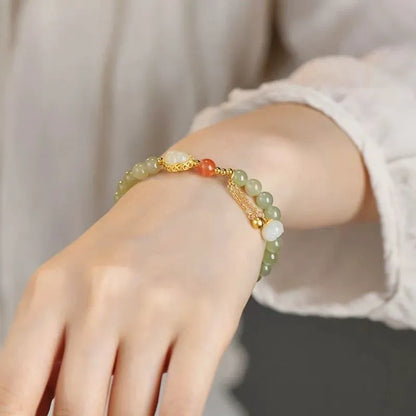 Qingshui jade women's bracelet with gold gourd charm and fu character on 6mm beads