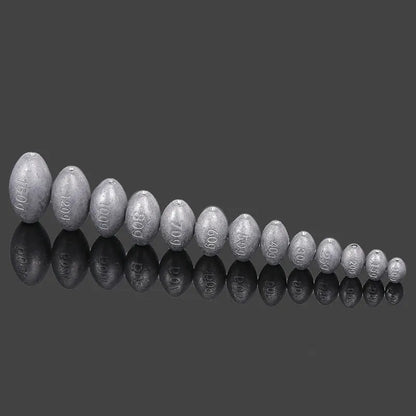Rugby-shaped lead fishing sinker with scaled texture and plastic core protection for sea fishing
