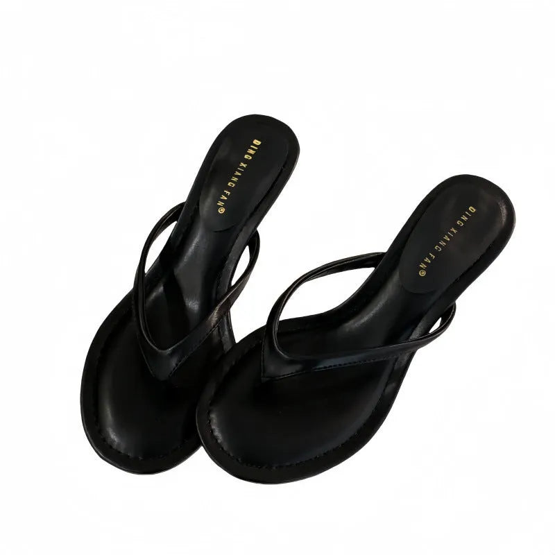 Women's open-toed stiletto sandals in rubber construction showing round toe design