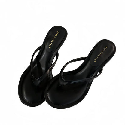 Women's open-toed stiletto sandals in rubber construction showing round toe design