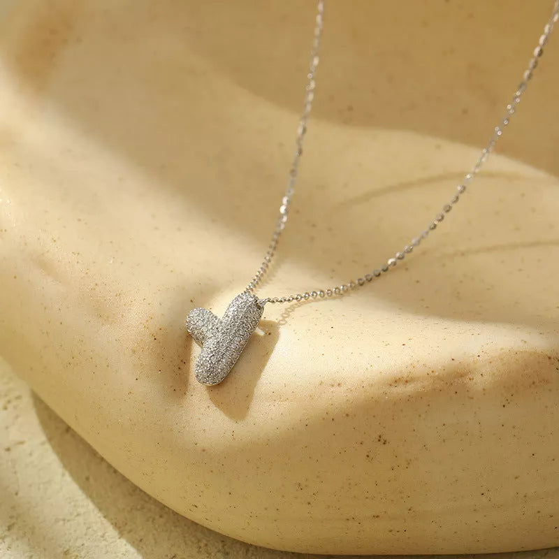 Stainless steel initial pendant necklace with zircon accents, personalized with your choice of letter.