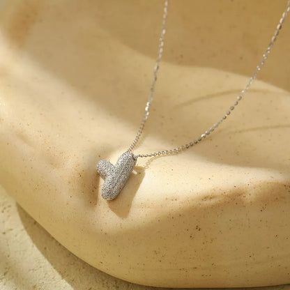 Stainless steel initial pendant necklace with zircon accents, personalized with your choice of letter.