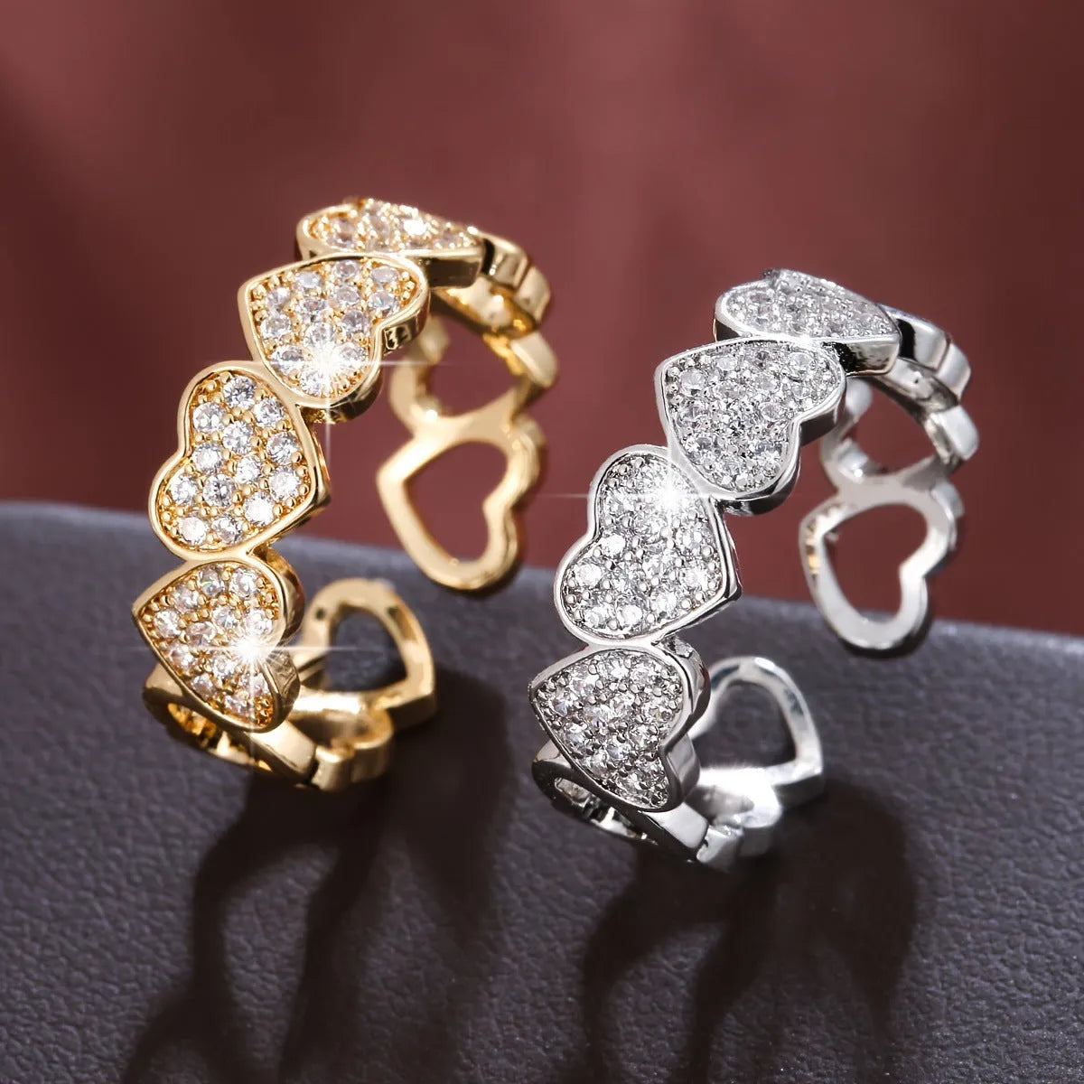 Adjustable opening couples ring with heart motif, gold and silver finishes, geometric shape, diamond treatment on copper