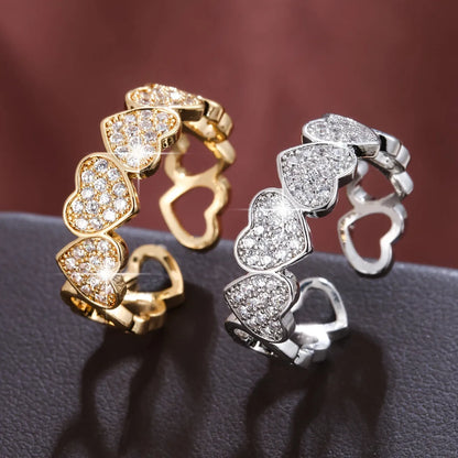 Adjustable opening couples ring with heart motif, gold and silver finishes, geometric shape, diamond treatment on copper