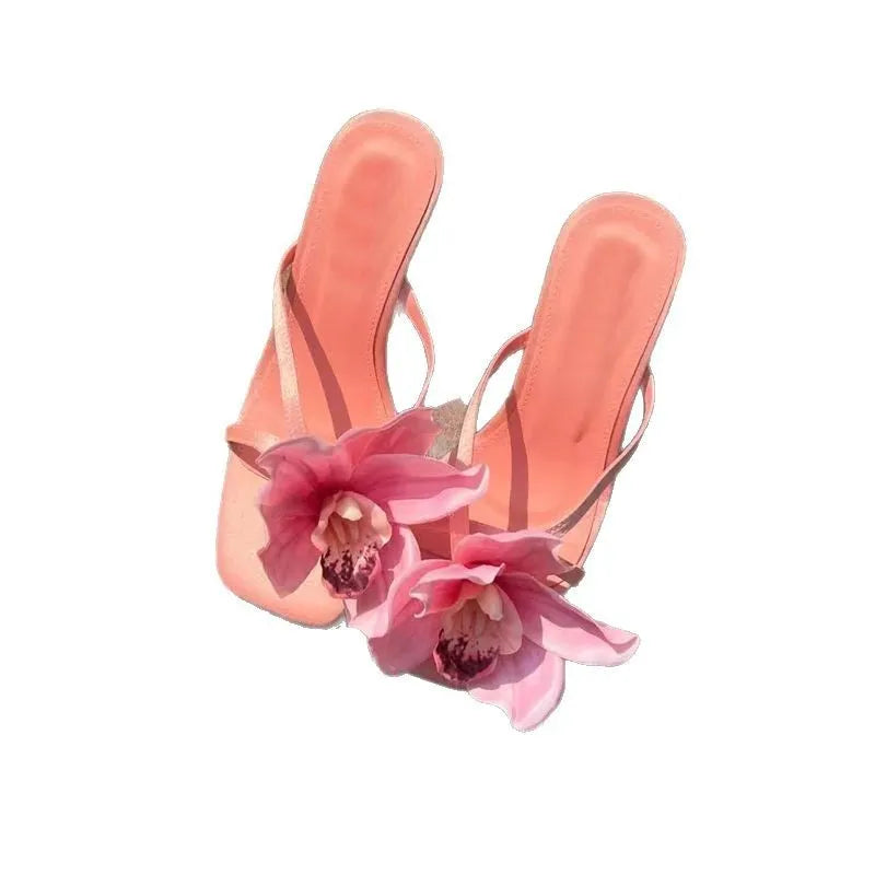 Pink women's flip-flop sandals with artificial Phalaenopsis orchid flower and square-toe design