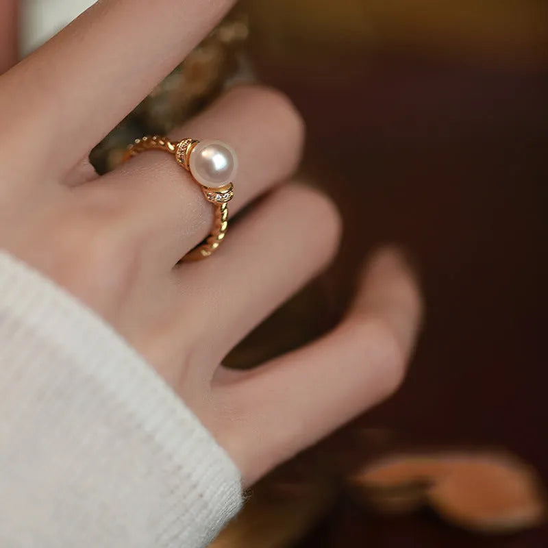Adjustable copper ring with pearl inlay in geometric twist design, gold or silver finish