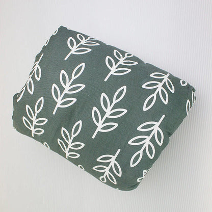 Adjustable cotton nursing pillow with various colorful designs, providing comfort and support for breastfeeding and bottle-feeding