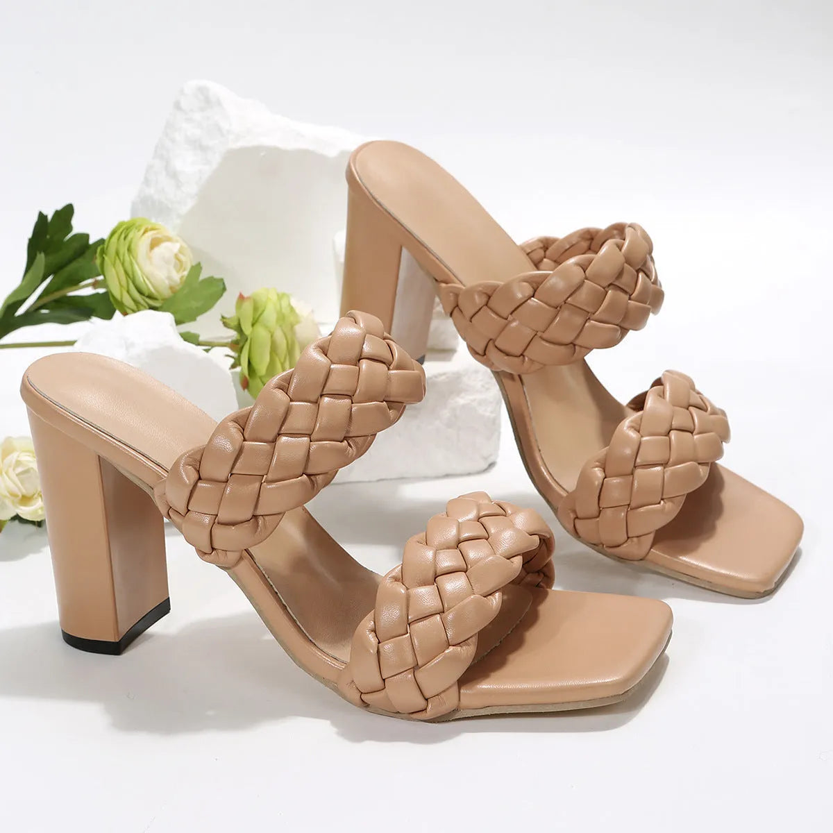 Women's square toe flip flops with woven PU straps and a chunky rubber sole in apricot colour.