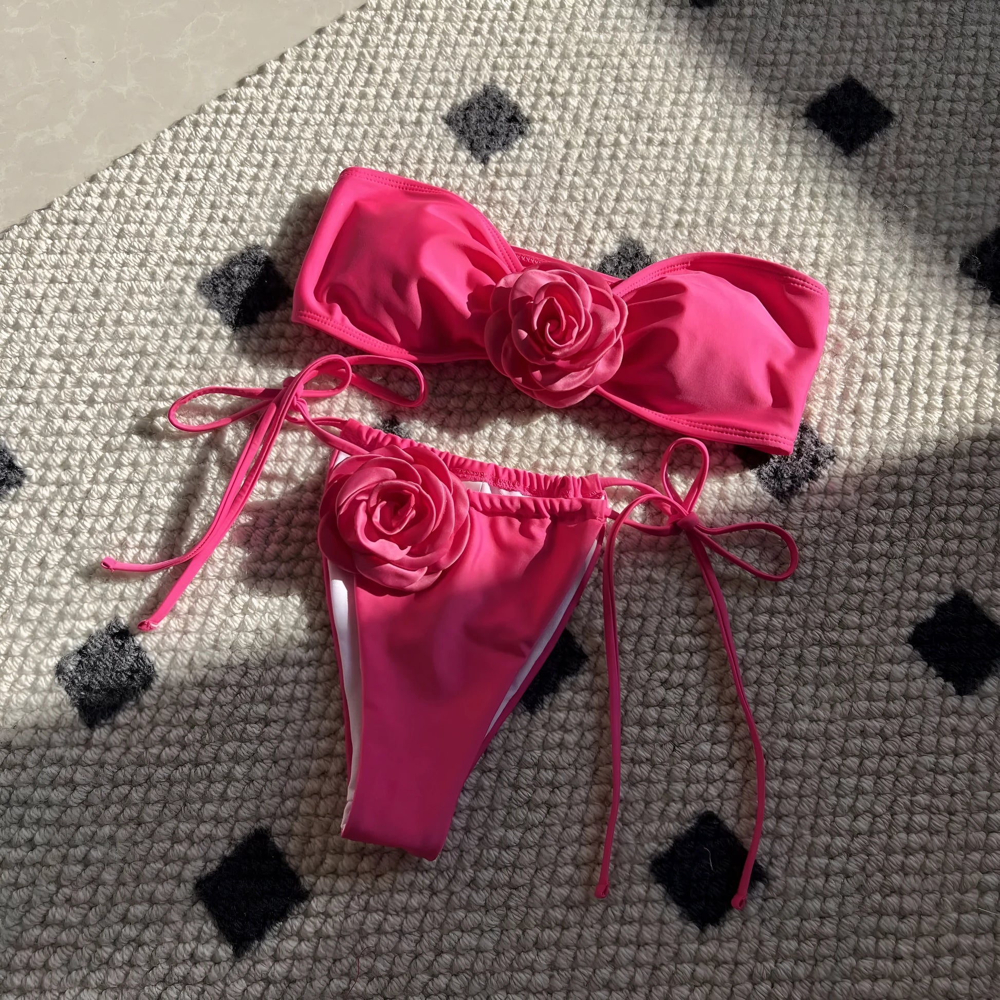Women's adjustable drawstring tube top swimsuit with high-cut briefs in a solid colour.