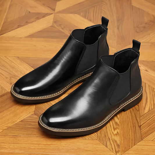 Black and brown formal pointed-toe leather boots with a square heel on a rubber sole.