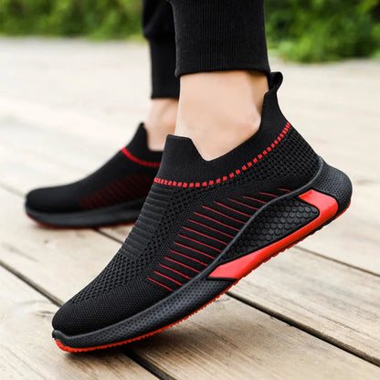 Men's black and white striped mesh slip-on sneakers with lace-up front.