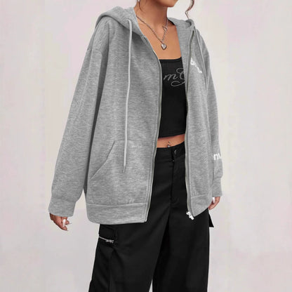 Grey loose fit men's sweater coat with a front zipper, modelled casually.