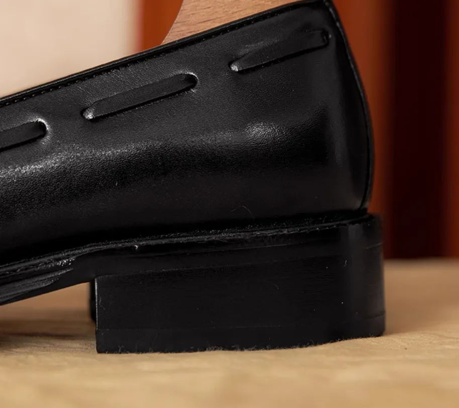 Men's black genuine leather slip-on loafers with polished finish and rubber sole