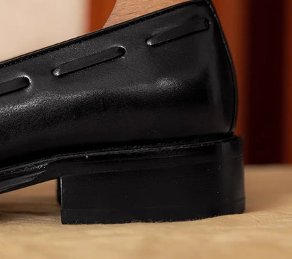 Men's black genuine leather slip-on loafers with polished finish and rubber sole