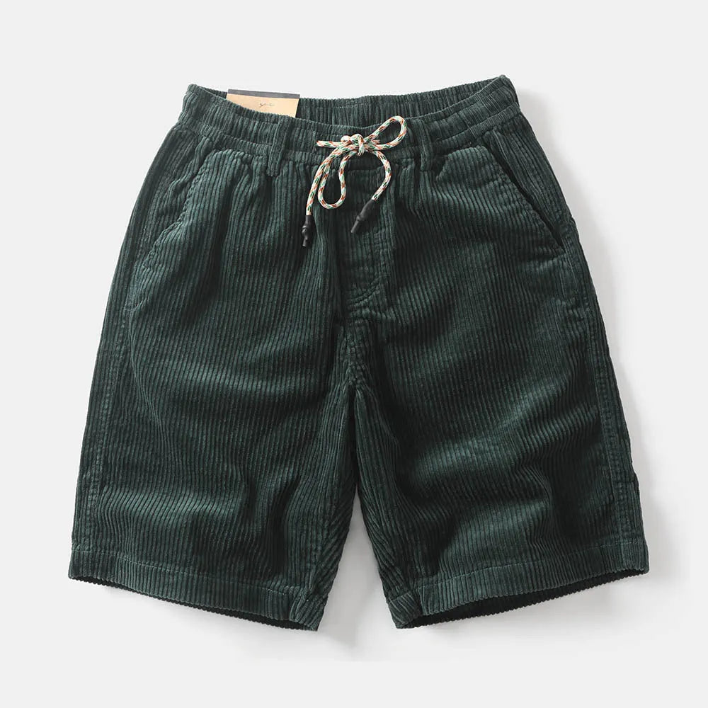 Men's khaki cargo shorts with multiple pockets on a straight-leg fit, shown on a hanger.