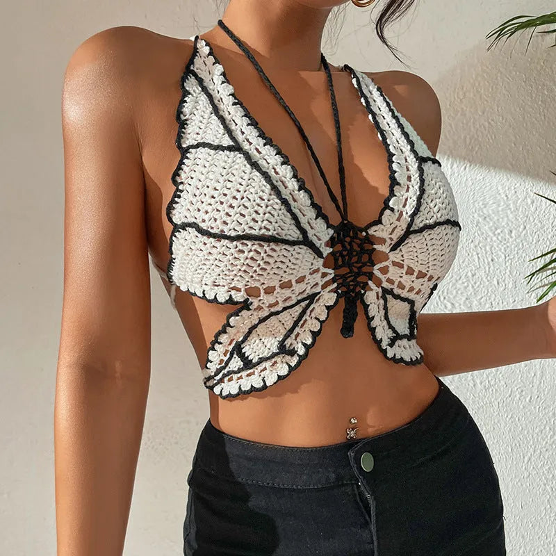 Black and white women's two-piece acrylic bikini swimsuit on a free-size hanger.