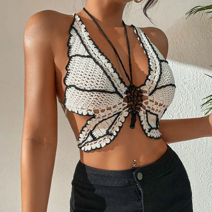 Black and white women's two-piece acrylic bikini swimsuit on a free-size hanger.