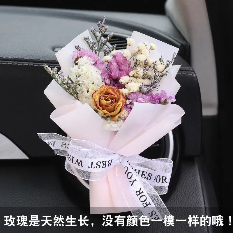 Mini dried flower bouquet mounted in car air vent for decorative aromatherapy