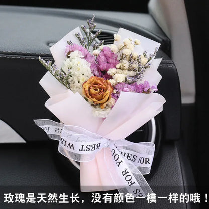 Mini dried flower bouquet mounted in car air vent for decorative aromatherapy
