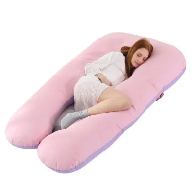 Large U-shaped pregnancy support pillow with removable cover and abdominal support belt.
