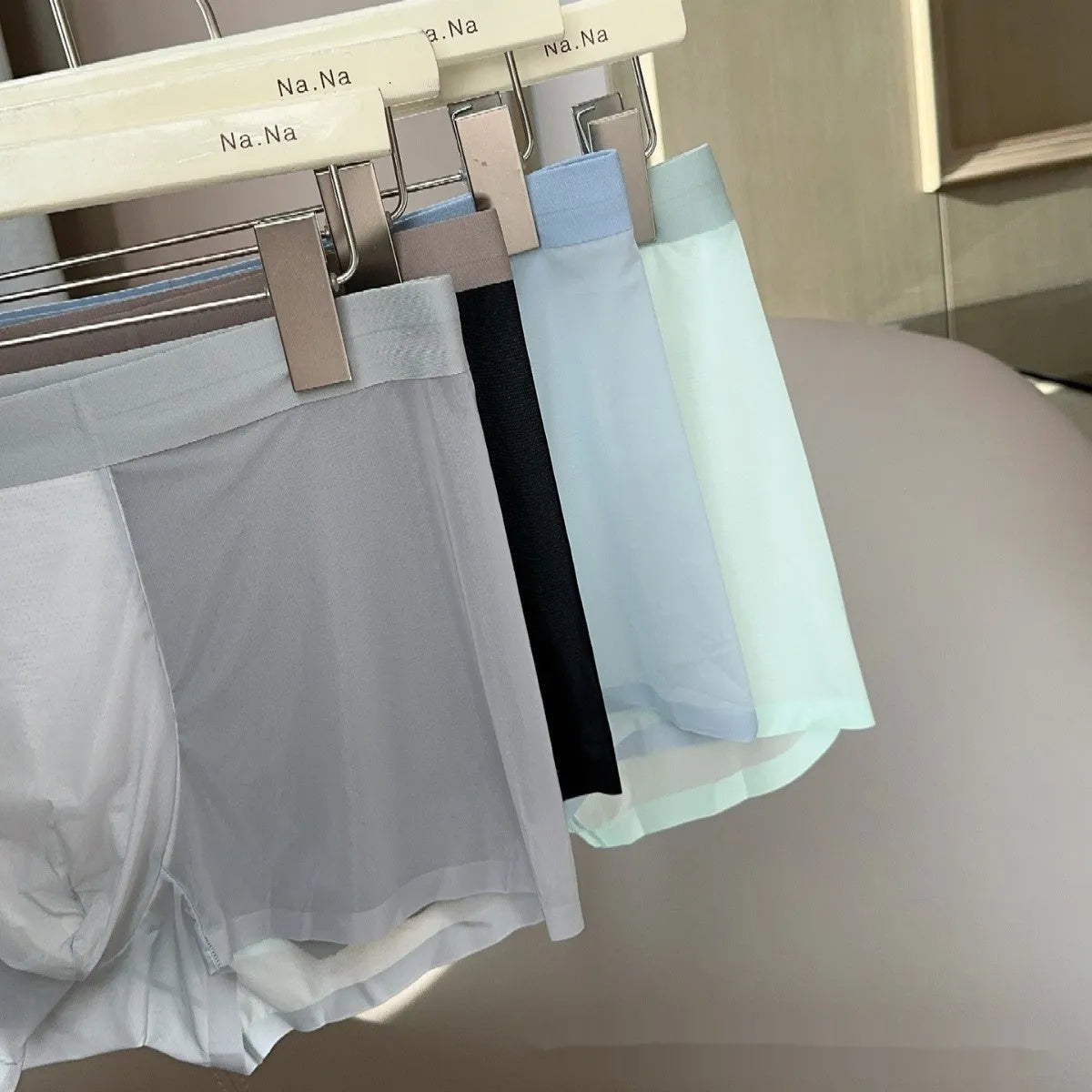 Ultra-thin seamless men's boxers in multiple colours showing honeycomb crotch design and mid-waist cut
