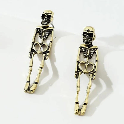 Halloween skull stud earrings in gold and silver, detailed design, lightweight alloy
