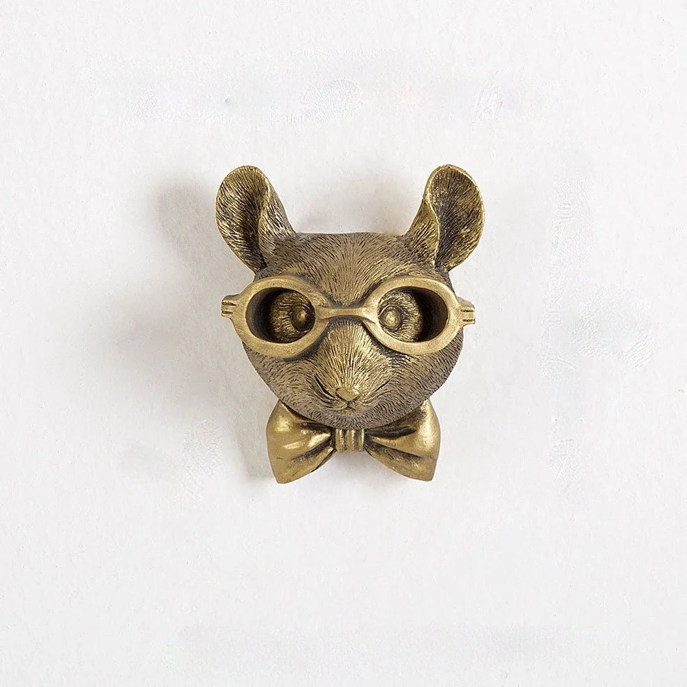 Antique bronze animal pendant showing bear design with synthetic resin construction