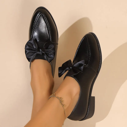 Women's British-style shoes with bow decoration, PU upper, and rubber sole in available sizes 36-43