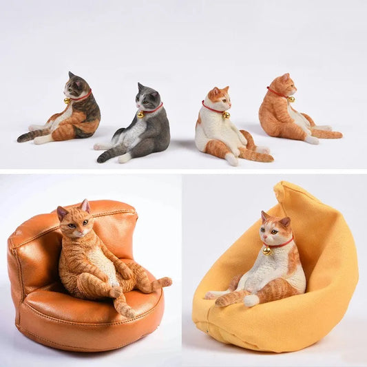 Lazy cat ornament on miniature sofa for car dashboard decoration, 7.5cm high with fabric art detailing