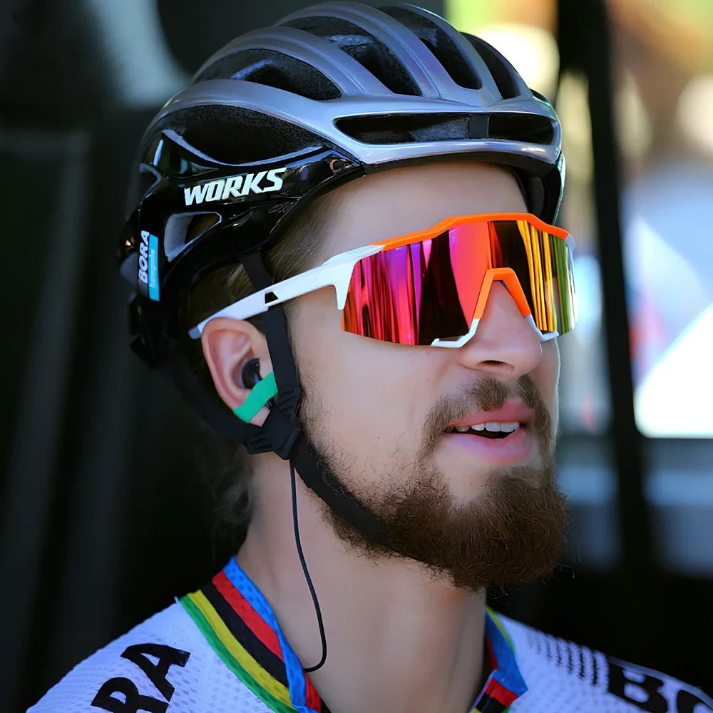 Cycling glasses with interchangeable lenses showing UV400 protection and lightweight frame design