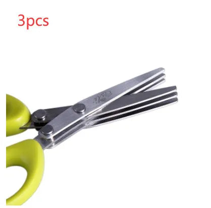 Green stainless steel multi-layer V-shaped kitchen scissors for cutting onions and herbs.