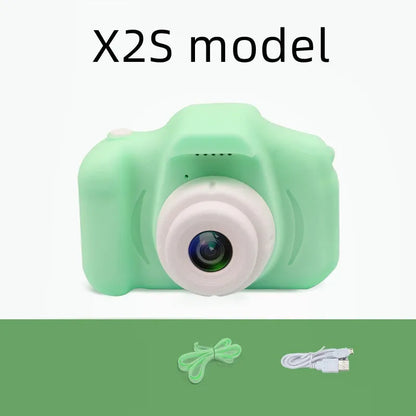 Colourful kids digital camera with silicone case showing 2-inch screen and lens.