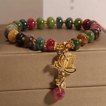 Colourful women's bracelet with butterfly charm, beads, and tourmaline accents on an alloy chain.
