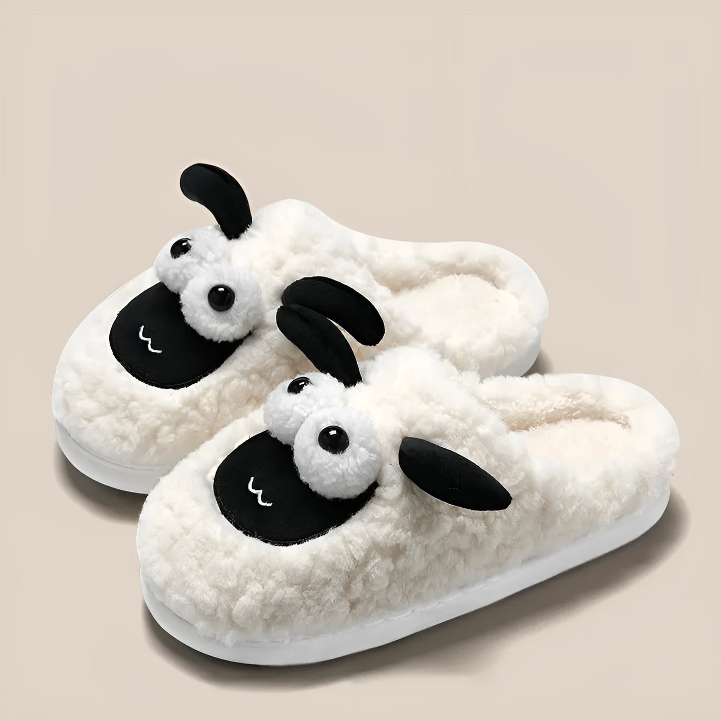Brown suede slip-on slippers with thermal cotton body and sewn PVC sole on a wooden floor.