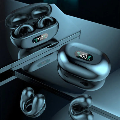 Bone conduction Bluetooth headset clip in black resting on ear with charging cable