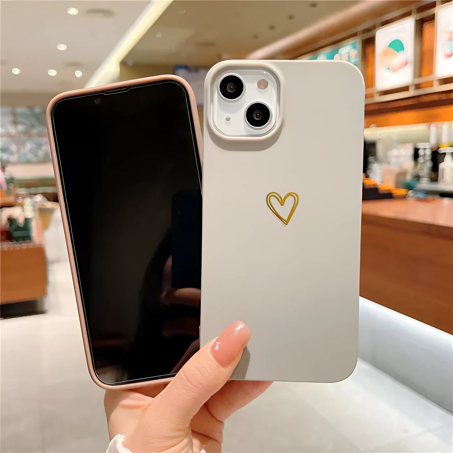 Brown soft silicone iPhone case with hot stamping Love design on a table